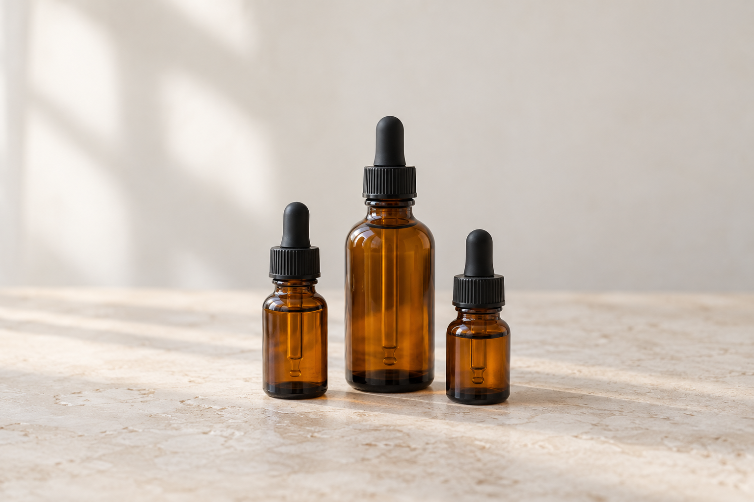 Illustrative image of three amber glass remedy bottles with dropper caps