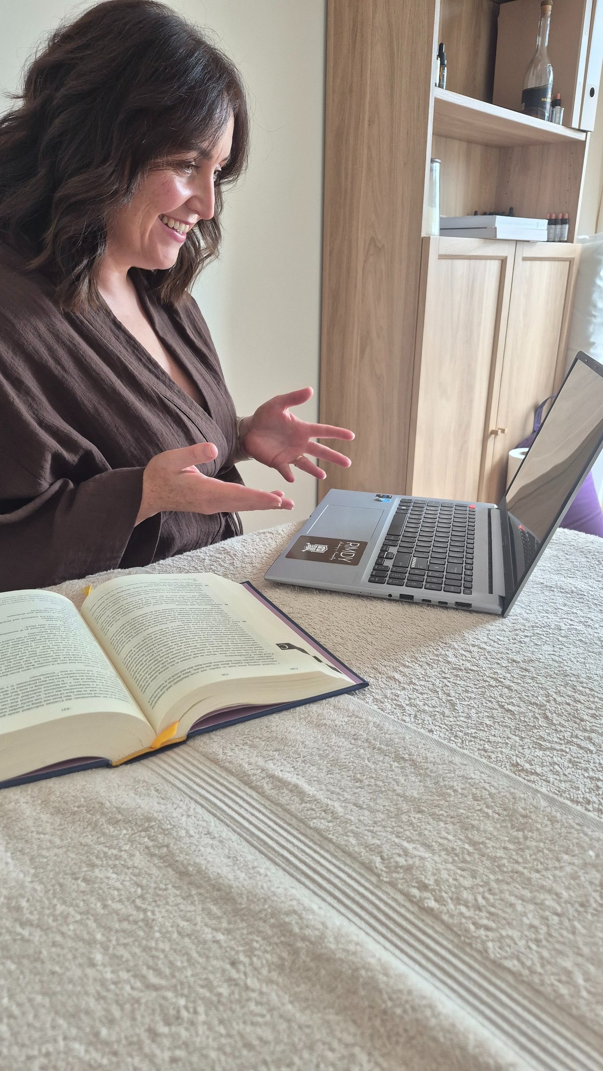 Lindsay offering an online consultation from her desk